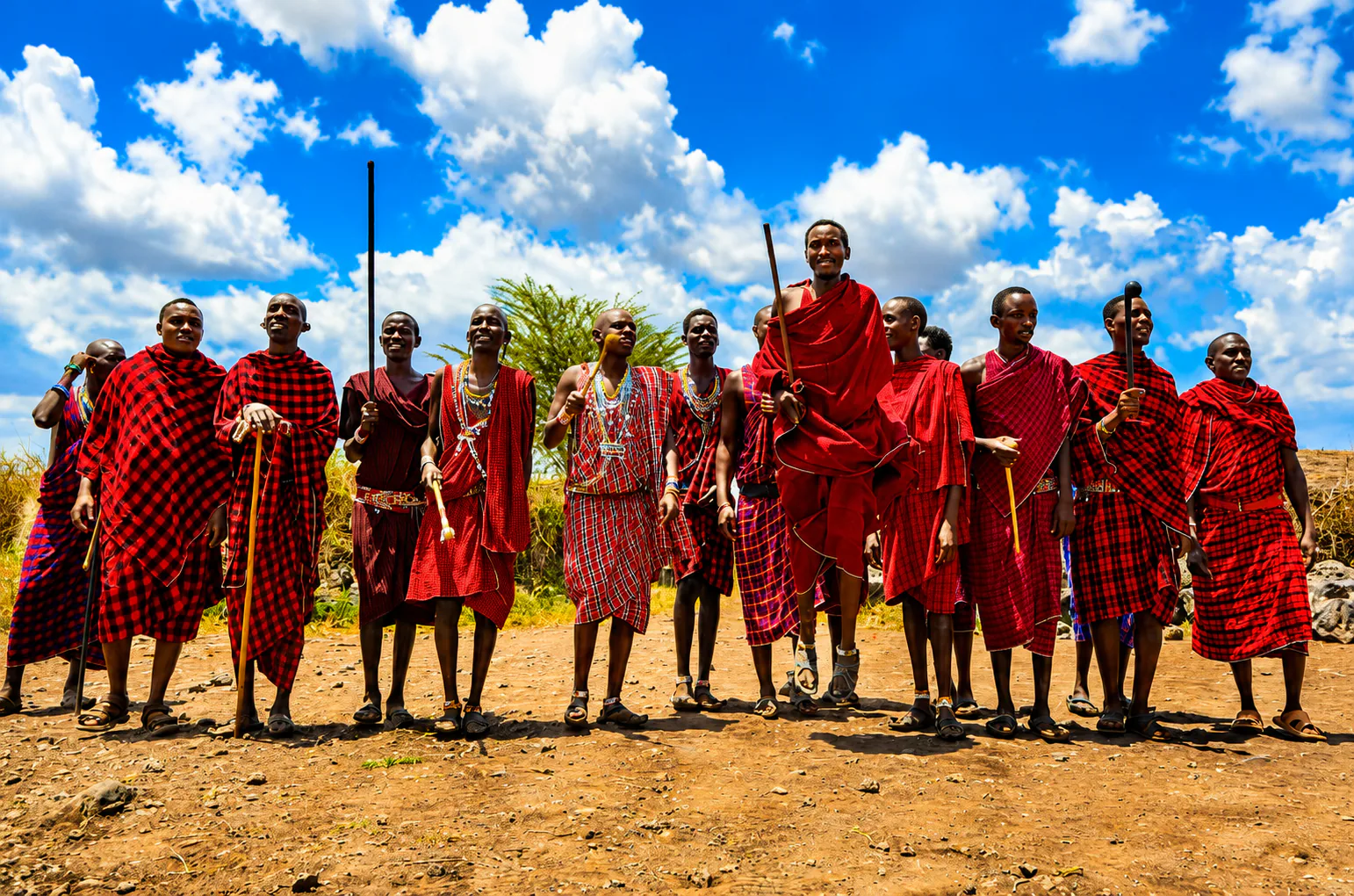 Maasai community members gathered in traditional red clothing